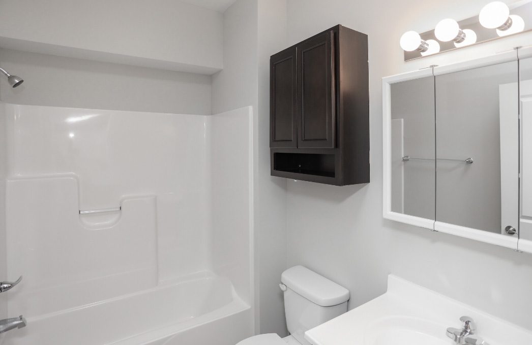 a bathroom with a toilet, sink and shower at The Alpine Studios